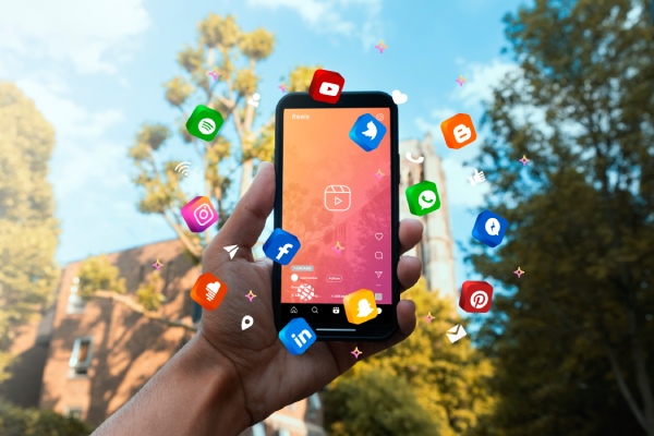 hand-holding-smartphone-social-media-concept (1) hand-holding-smartphone-social-media-concept (1)